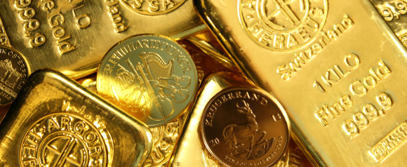 Close-up of shiny gold bars marked 1 KILO Fine Gold 999.9 and gold coins including Krugerrand and Philharmoniker designs. The image conveys tangible asset investment and is ideal for content about Birch Gold and Gold IRA diversification.