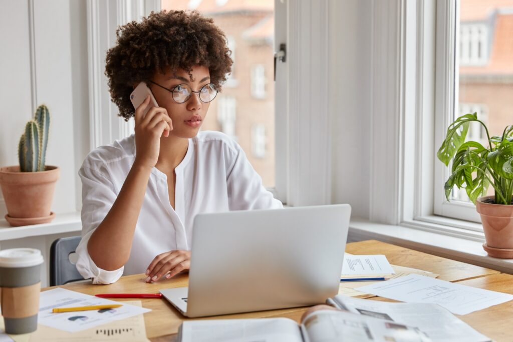 Self-employed professional on a phone consultation discussing tax relief options