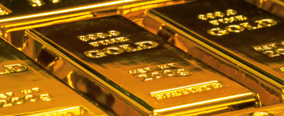 Close-up view of stacked gold bars with “999.9 Fine Gold” and “Net Wt 2008” engraved on the surface. The image highlights physical gold investment, suitable for illustrating Advantage Gold services or Gold IRA options.