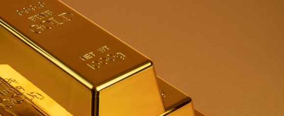 Stack of gleaming gold bars arranged in a pyramid shape on a gold-toned background. This image represents physical gold ownership and is ideal for illustrating American Hartford Gold services or Gold IRA investment opportunities.