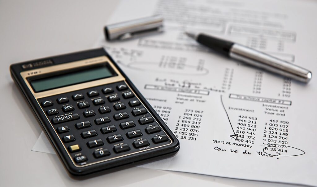 Financial calculator and tax documents prepared for an IRS Fresh Start Program application