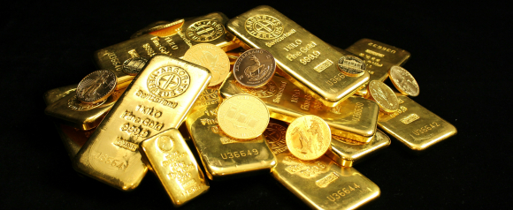 Stack of gold bars and gold coins on a black background, with markings indicating weight and purity. The image symbolizes wealth preservation and is ideal for illustrating topics related to Preserve Gold or investing in a Gold IRA.