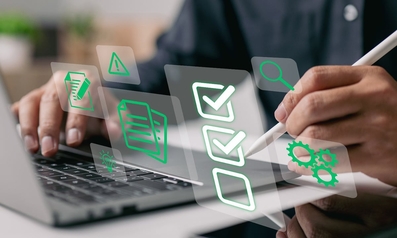 Person using a laptop and stylus with floating digital checklist and document icons representing a background screening process.